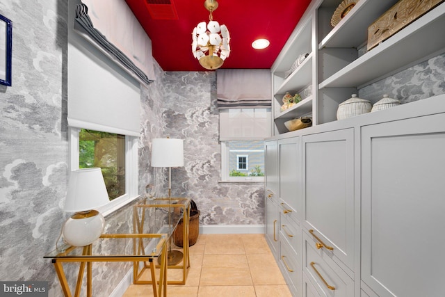 777 3rd St, Herndon, VA 20170 - interior space with tile patterned floors, baseboards, and a chandelier