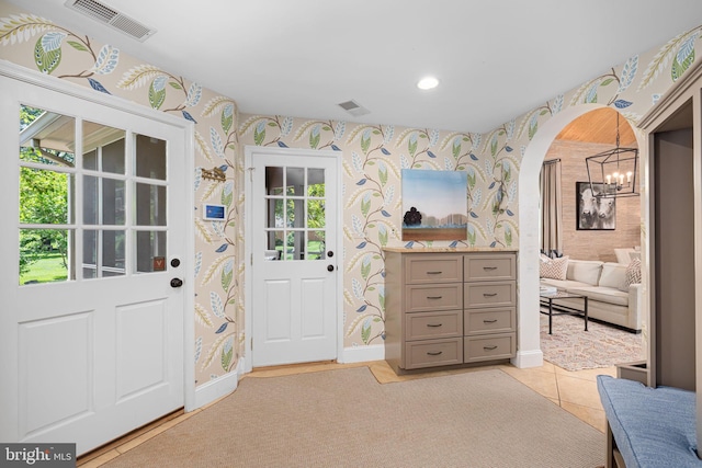 777 3rd St, Herndon, VA 20170 - entrance foyer with wallpapered walls, baseboards, arched walkways, light tile patterned floors, and recessed lighting