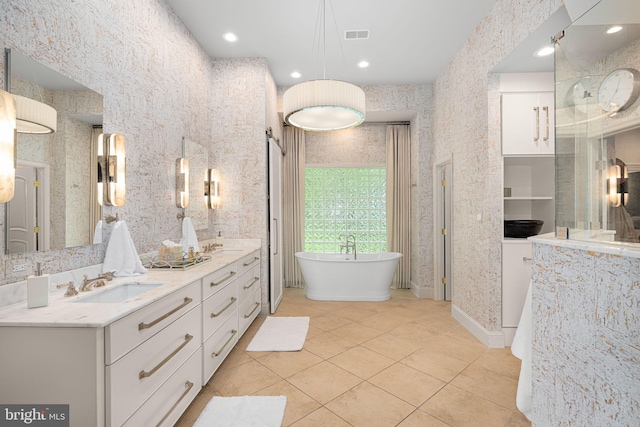 777 3rd St, Herndon, VA 20170 - bathroom featuring double vanity, a freestanding bath, and tile patterned flooring