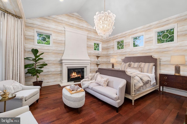 777 3rd St, Herndon, VA 20170 - bedroom featuring lofted ceiling, hardwood / wood-style floors, a chandelier, and a glass covered fireplace