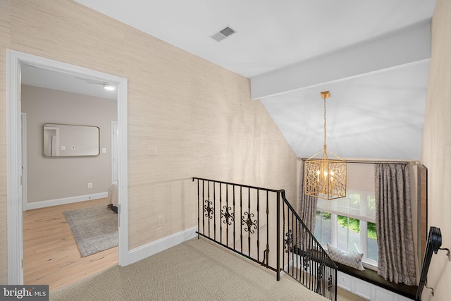 777 3rd St, Herndon, VA 20170 - hallway with a chandelier, an upstairs landing, wood finished floors, baseboards, and lofted ceiling
