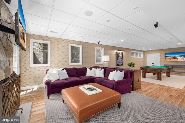 777 3rd St, Herndon, VA 20170 - living room with wallpapered walls, light wood finished floors, billiards, a paneled ceiling, and baseboards