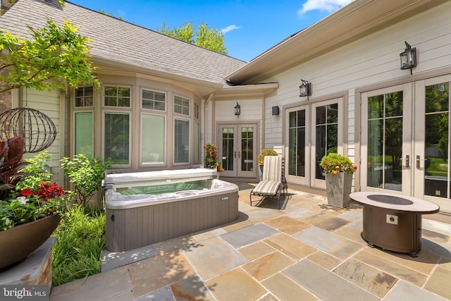 777 3rd St, Herndon, VA 20170 - view of patio with french doors, a hot tub, and an outdoor fire pit