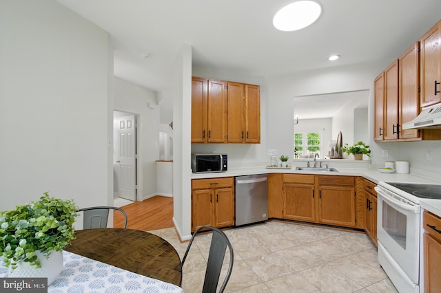 6201 Knolls Ct, Elkridge, MD 21075 - kitchen with stainless steel appliances, light countertops, a sink, under cabinet range hood, and light tile patterned floors