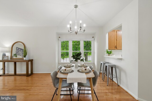 6201 Knolls Ct, Elkridge, MD 21075 - dining area featuring a chandelier, light wood-style flooring, and baseboards