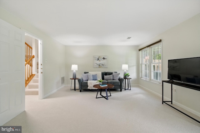 6201 Knolls Ct, Elkridge, MD 21075 - carpeted living area with baseboards and stairs
