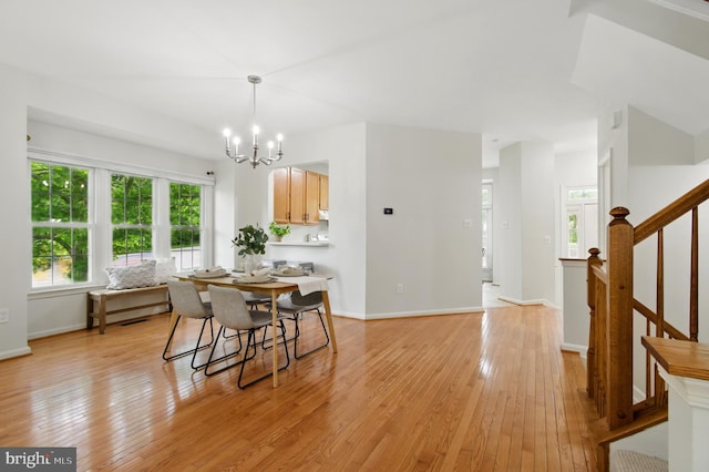 6201 Knolls Ct, Elkridge, MD 21075 - dining room featuring light wood-style flooring, a chandelier, baseboards, and stairs