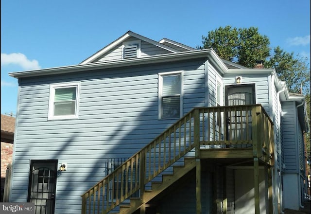 4909 Meade St NE, Washington, DC 20019 - back of house with a chimney and a wooden deck