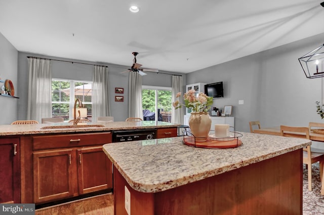 3061 Raking Leaf Dr, Abingdon, MD 21009 - kitchen with a kitchen island, a sink, plenty of natural light, and light wood-type flooring