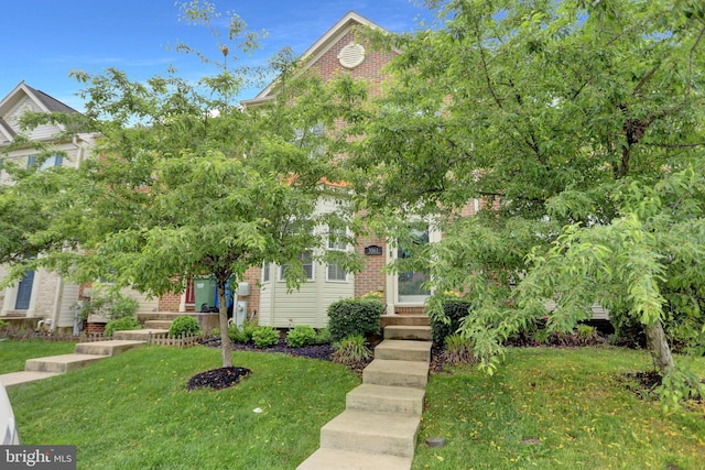 3061 Raking Leaf Dr, Abingdon, MD 21009 - view of front facade featuring a front yard and brick siding