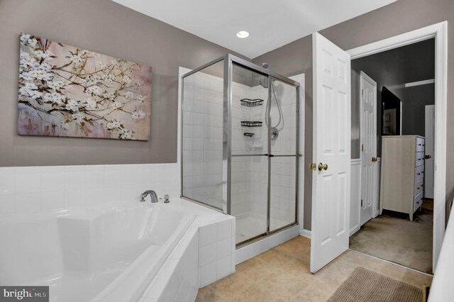 3061 Raking Leaf Dr, Abingdon, MD 21009 - bathroom featuring a bath, a shower stall, and tile patterned flooring
