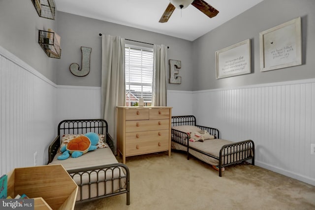3061 Raking Leaf Dr, Abingdon, MD 21009 - bedroom featuring wainscoting, light colored carpet, and ceiling fan