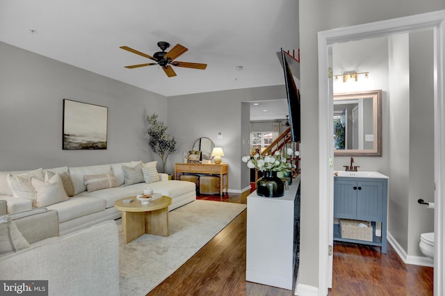 3061 Raking Leaf Dr, Abingdon, MD 21009 - living area with ceiling fan, dark wood-type flooring, baseboards, and stairs