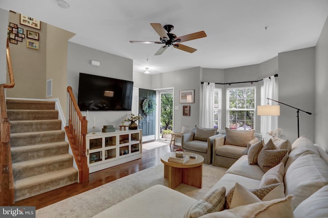 3061 Raking Leaf Dr, Abingdon, MD 21009 - living area featuring wood finished floors, ceiling fan, and stairs