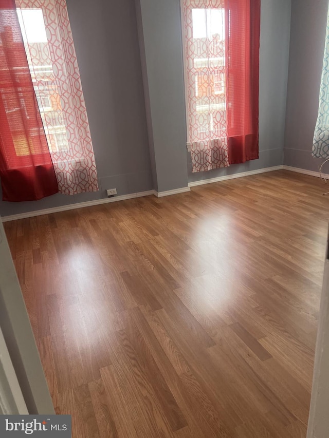 4839 Griscom St, Philadelphia, PA 19124 - unfurnished room with healthy amount of natural light, wood finished floors, and baseboards