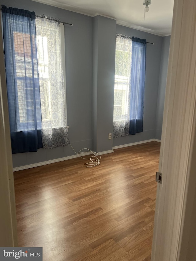 4839 Griscom St, Philadelphia, PA 19124 - unfurnished room featuring wood finished floors, baseboards, and crown molding