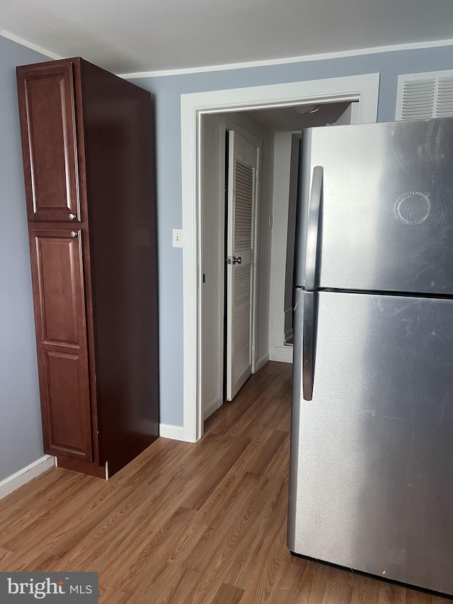 4839 Griscom St, Philadelphia, PA 19124 - kitchen with freestanding refrigerator, light wood-style flooring, and baseboards