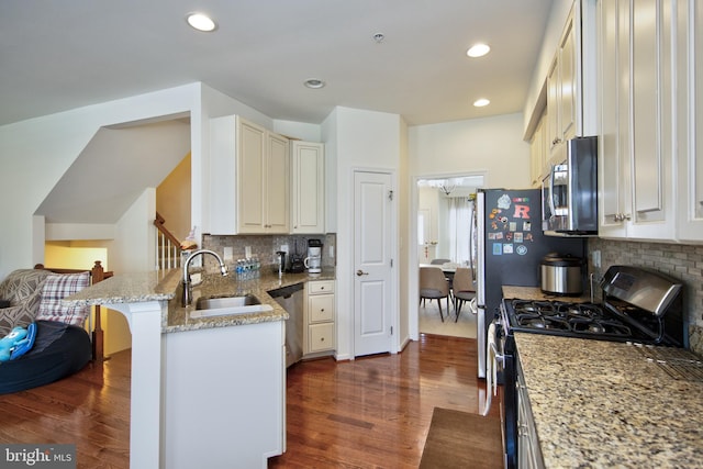 714 Shady Creek Ct, Bel Air, MD 21015 - kitchen featuring stainless steel appliances, dark wood finished floors, a sink, tasteful backsplash, and light stone counters