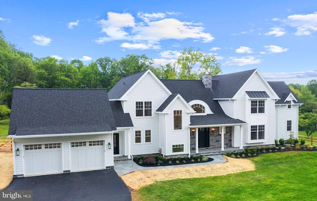 3718 Gradyville Rd, Newtown Square, PA 19073 - view of front of house with a garage, asphalt driveway, a porch, a front lawn, and a shingled roof