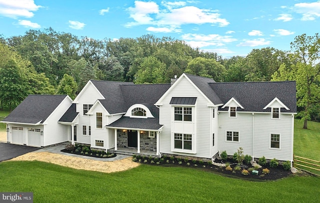 3718 Gradyville Rd, Newtown Square, PA 19073 - view of front facade featuring a porch, asphalt driveway, a front lawn, a garage, and roof with shingles