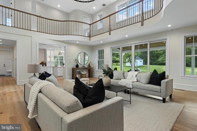 3718 Gradyville Rd, Newtown Square, PA 19073 - living room featuring a towering ceiling, light wood finished floors, recessed lighting, and baseboards
