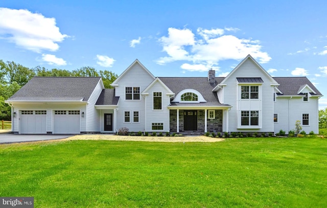 3718 Gradyville Rd, Newtown Square, PA 19073 - view of front of home with a garage, a front yard, driveway, a chimney, and roof with shingles
