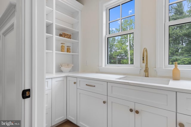 3718 Gradyville Rd, Newtown Square, PA 19073 - kitchen with a sink, plenty of natural light, open shelves, and white cabinets