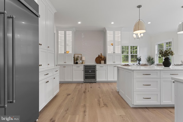 3718 Gradyville Rd, Newtown Square, PA 19073 - kitchen featuring high end refrigerator, wine cooler, white cabinets, glass insert cabinets, and recessed lighting
