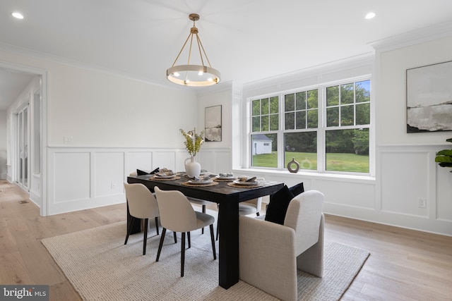 3718 Gradyville Rd, Newtown Square, PA 19073 - dining space featuring a decorative wall, crown molding, light wood finished floors, and a wainscoted wall