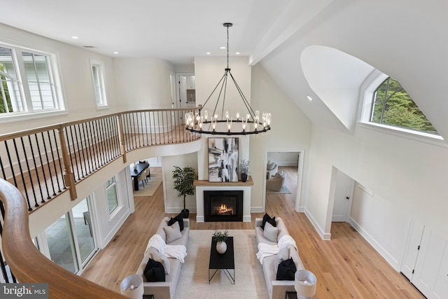 3718 Gradyville Rd, Newtown Square, PA 19073 - living area featuring a chandelier, wood finished floors, high vaulted ceiling, baseboards, and recessed lighting