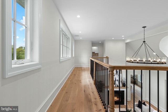 3718 Gradyville Rd, Newtown Square, PA 19073 - corridor with plenty of natural light, light wood-type flooring, a chandelier, baseboards, and recessed lighting