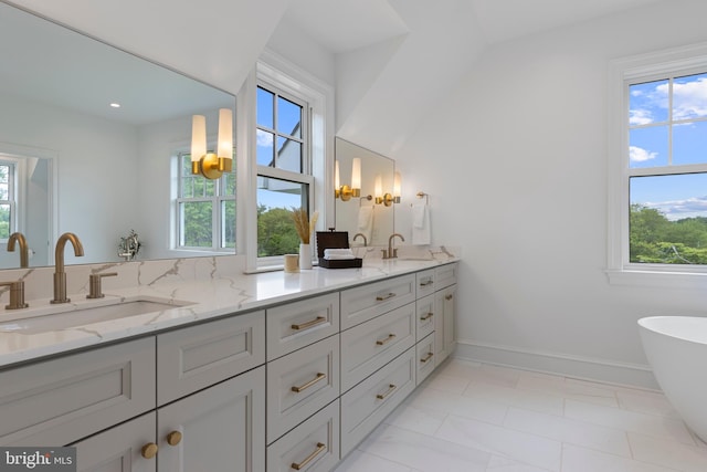 3718 Gradyville Rd, Newtown Square, PA 19073 - bathroom featuring double vanity, healthy amount of natural light, and a freestanding bath