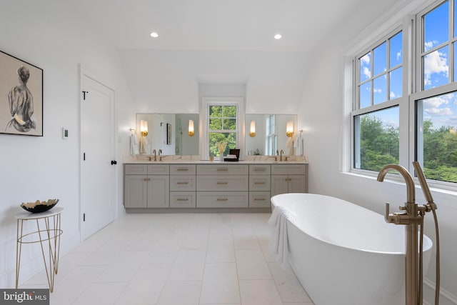 3718 Gradyville Rd, Newtown Square, PA 19073 - bathroom featuring double vanity, a soaking tub, and recessed lighting