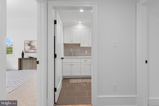 3718 Gradyville Rd, Newtown Square, PA 19073 - hallway featuring a sink, dark tile patterned flooring, baseboards, and recessed lighting