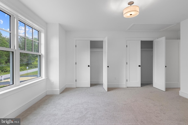 3718 Gradyville Rd, Newtown Square, PA 19073 - unfurnished bedroom with multiple closets, attic access, light carpet, and baseboards
