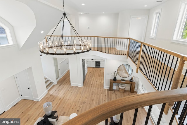 3718 Gradyville Rd, Newtown Square, PA 19073 - stairway with wood-type flooring, a chandelier, recessed lighting, and baseboards