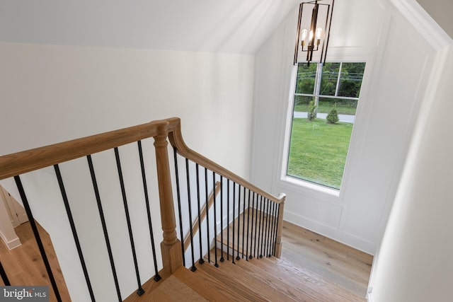 3718 Gradyville Rd, Newtown Square, PA 19073 - staircase with wood finished floors, a chandelier, and vaulted ceiling