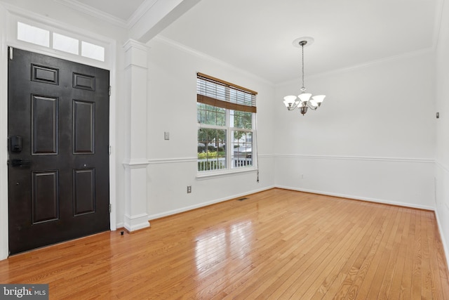 9901 Airedale Ct, Bristow, VA 20136 - foyer entrance with a chandelier, wood-type flooring, ornamental molding, and baseboards