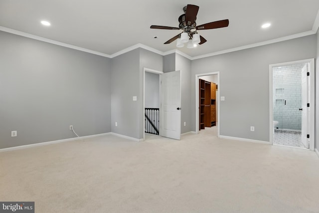 9901 Airedale Ct, Bristow, VA 20136 - unfurnished bedroom featuring light carpet, ornamental molding, recessed lighting, baseboards, and a spacious closet