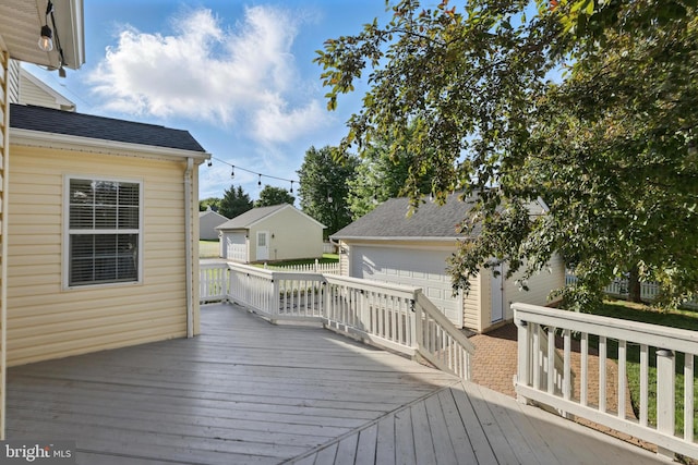 9901 Airedale Ct, Bristow, VA 20136 - deck featuring a garage and an outdoor structure