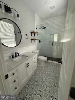 9901 Airedale Ct, Bristow, VA 20136 - full bath with vanity, a stall shower, and toilet
