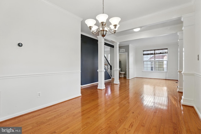 9901 Airedale Ct, Bristow, VA 20136 - empty room featuring light wood finished floors, a chandelier, stairs, ornamental molding, and baseboards