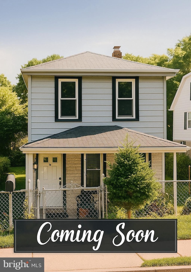 6202 K St, Capitol Heights, MD 20743 - view of front of property with a chimney, covered porch, and roof with shingles