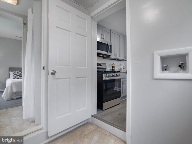 6202 K St, Capitol Heights, MD 20743 - kitchen featuring stainless steel appliances and light tile patterned floors