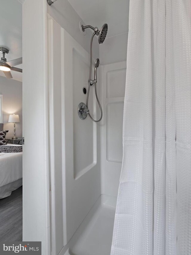 6202 K St, Capitol Heights, MD 20743 - detailed view of a shower with curtain, ensuite bath, and ceiling fan