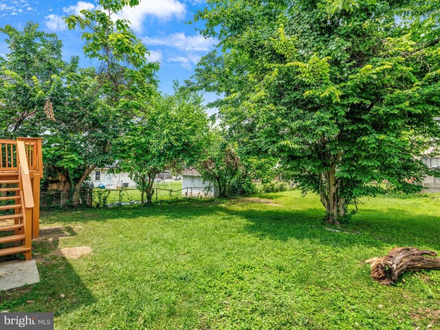 6202 K St, Capitol Heights, MD 20743 - view of yard featuring stairway and a wooden deck