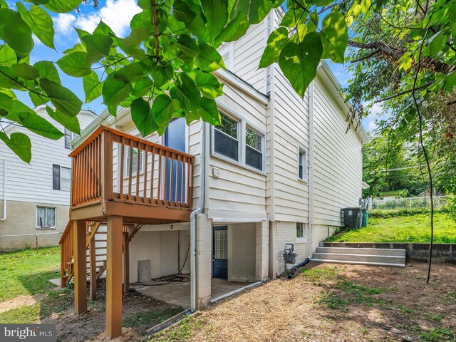 6202 K St, Capitol Heights, MD 20743 - rear view of house with stairway, a deck, and a patio