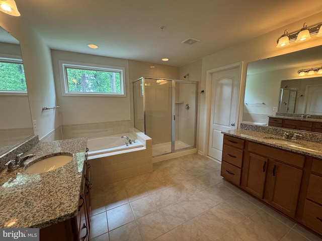 2410 Vineyard Springs Way, Ellicott City, MD 21043 - full bathroom featuring a stall shower, two vanities, tile patterned floors, a bath, and recessed lighting