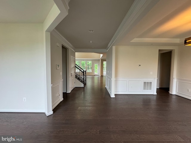 2410 Vineyard Springs Way, Ellicott City, MD 21043 - hallway featuring dark wood finished floors, stairs, crown molding, a wainscoted wall, and a decorative wall