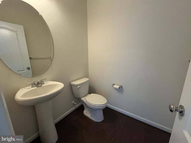 2410 Vineyard Springs Way, Ellicott City, MD 21043 - half bath featuring toilet, baseboards, wood finished floors, and a sink